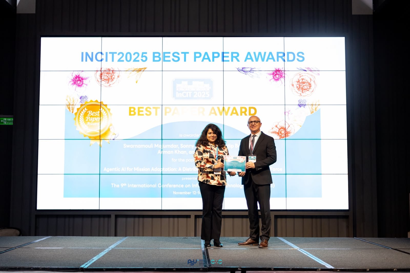 Swarnamouli Majumdar accepting an IncIT 2025 Best Paper Award.